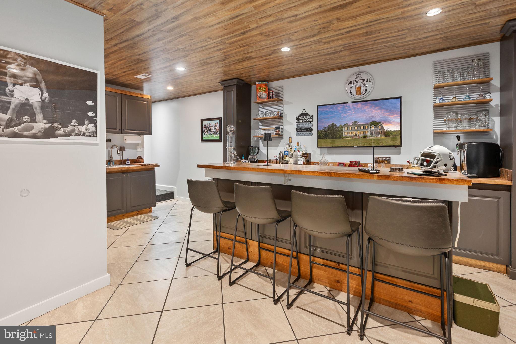 22088 Landora Bridge Road Ruther Glen, VA 22546 - Photo 79 of 122 Stylish basement bar for entertaining.