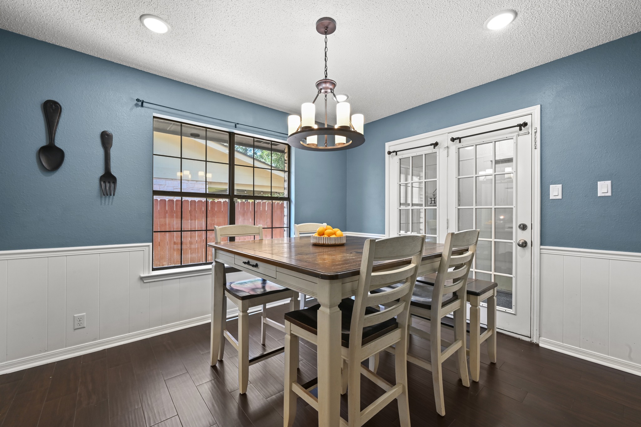 303 Pin Oak Drive Georgetown, TX 78628 - Photo 12 of 36 a view of a dining room with furniture window and wooden floor