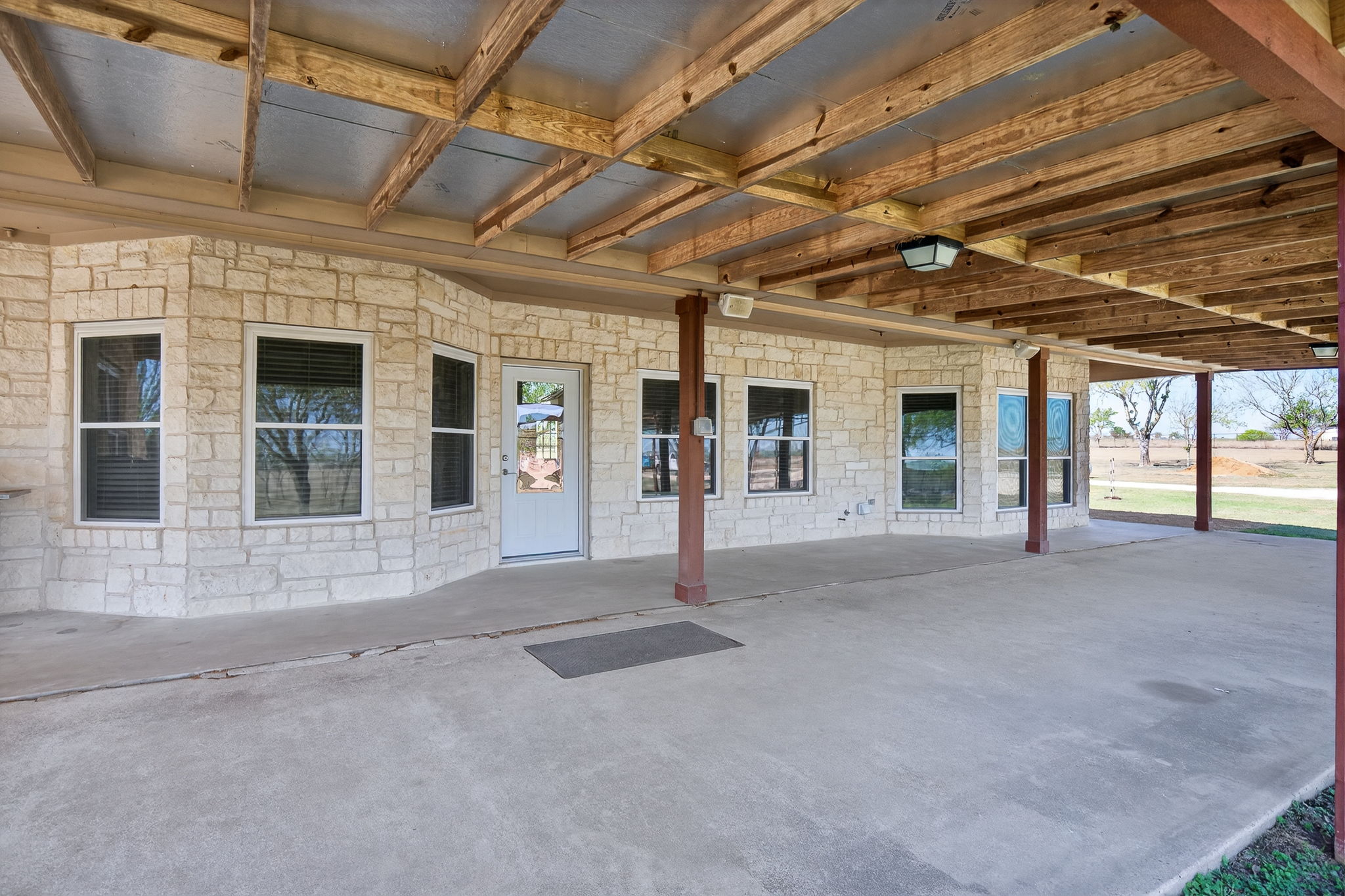 13639 Abrahamson Road Elgin, TX 78621 - Photo 21 of 30 Back patio, porch setting