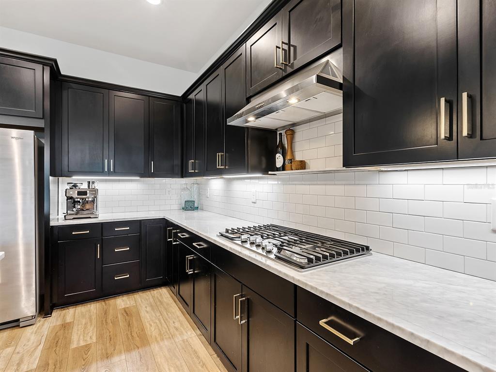 7857 Redonda Loop Lakewood Ranch, FL 34202 - Photo 11 of 51 a kitchen with a sink and cabinets