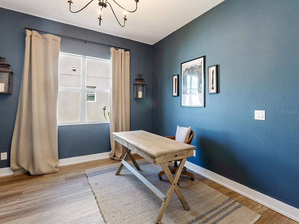 7857 Redonda Loop Lakewood Ranch, FL 34202 - Photo 18 of 51 a room with a table and windows