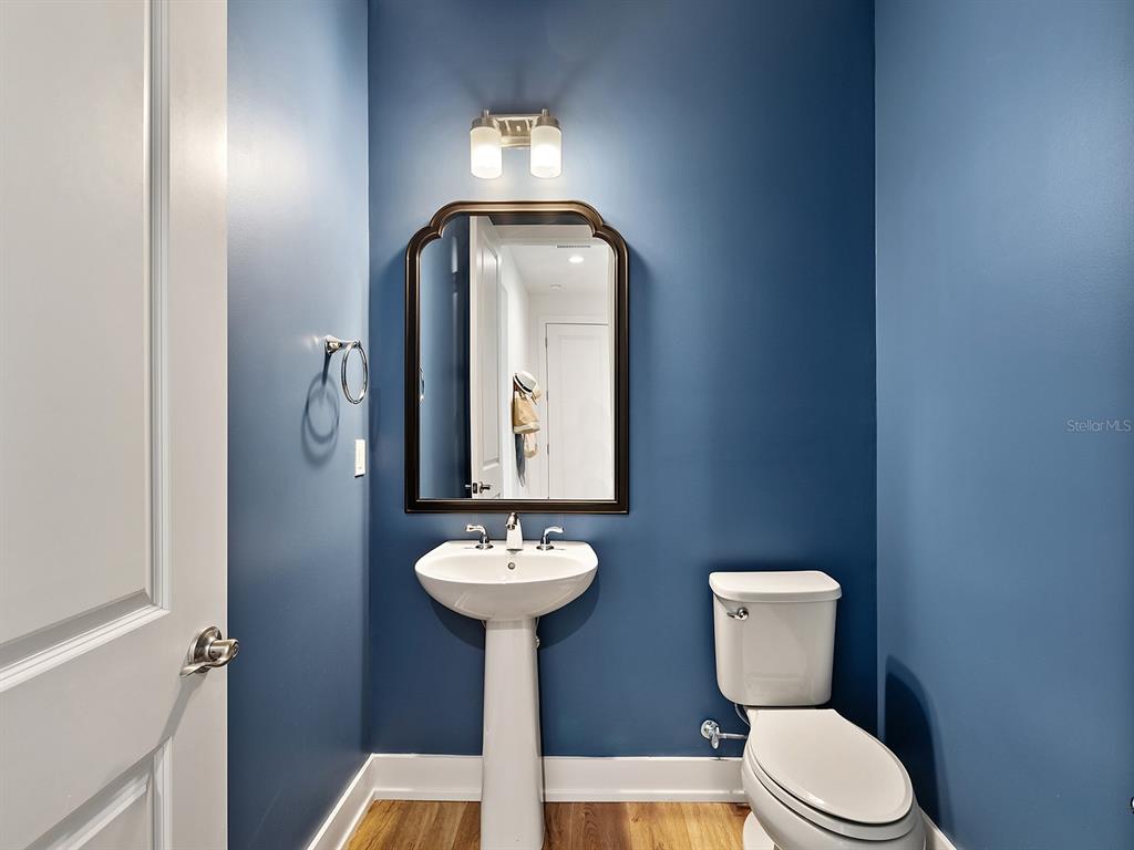 7857 Redonda Loop Lakewood Ranch, FL 34202 - Photo 20 of 51 a bathroom with a toilet sink and mirror