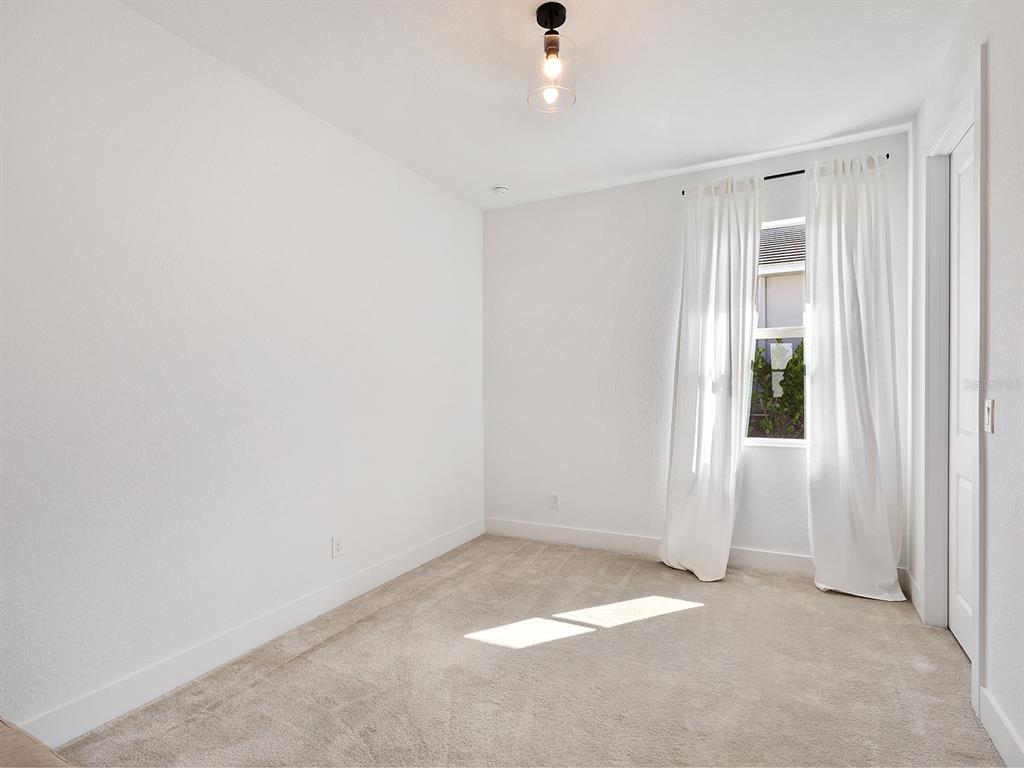 7857 Redonda Loop Lakewood Ranch, FL 34202 - Photo 28 of 51 a view of an empty room with a window