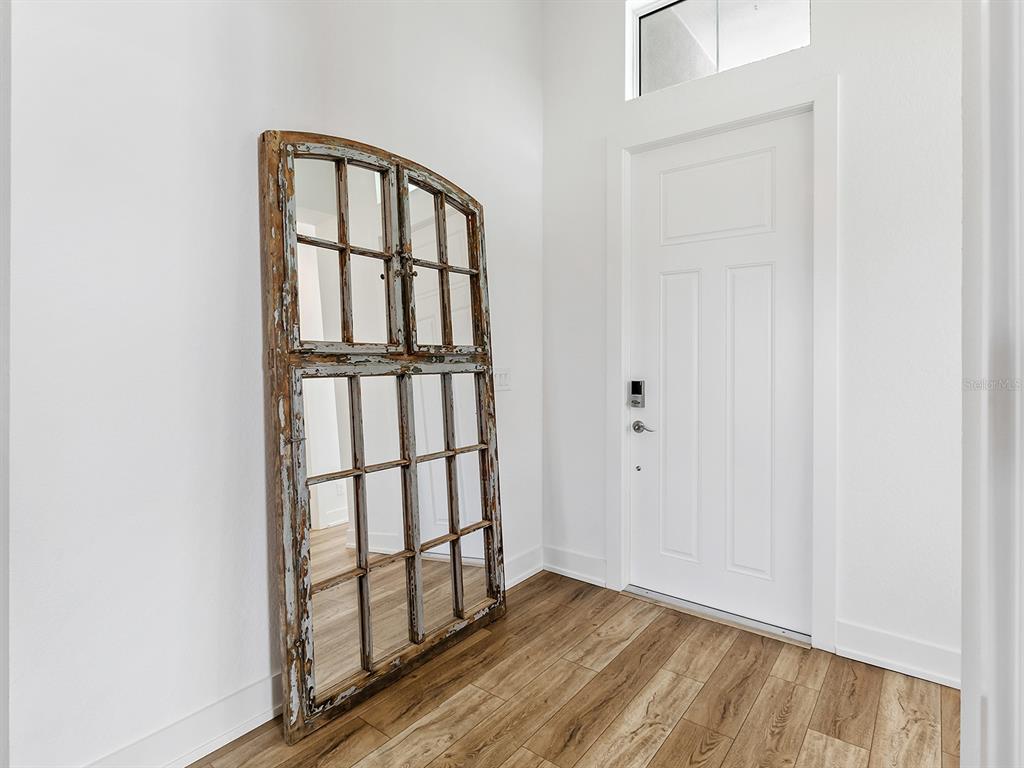 7857 Redonda Loop Lakewood Ranch, FL 34202 - Photo 3 of 51 a view of staircase with white walls