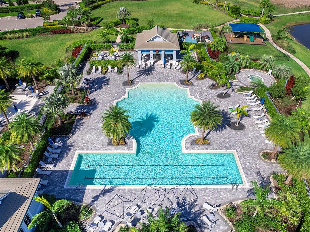 7857 Redonda Loop Lakewood Ranch, FL 34202 - Photo 36 of 51 an aerial view of multiple houses with yard