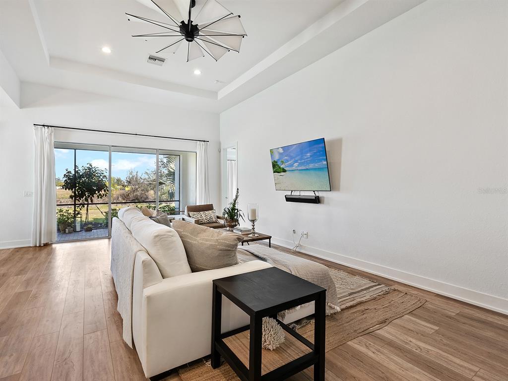 7857 Redonda Loop Lakewood Ranch, FL 34202 - Photo 4 of 51 a living room with furniture and a large window