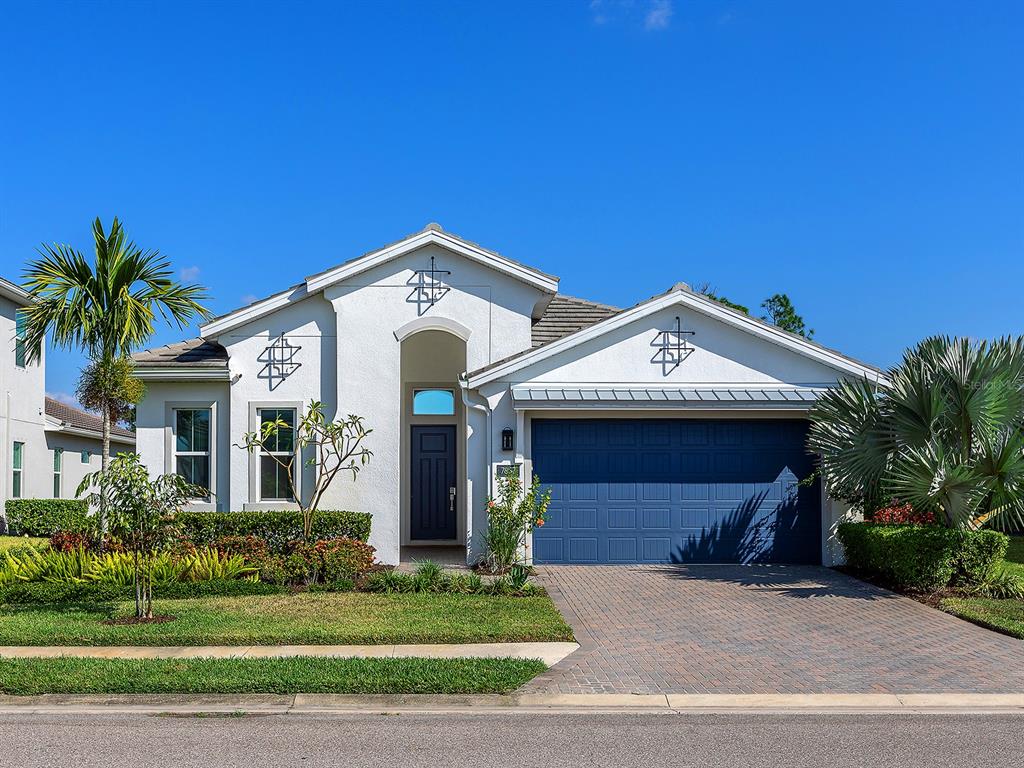 7857 Redonda Loop Lakewood Ranch, FL 34202 - Photo 51 of 51 a front view of a house with a yard