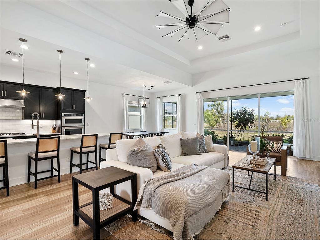 7857 Redonda Loop Lakewood Ranch, FL 34202 - Photo 6 of 51 a living room with furniture and a large window