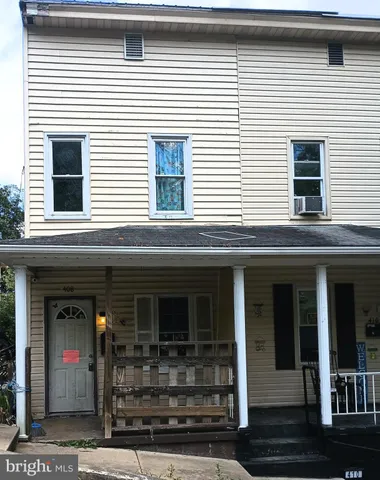 a view of a house with large windows