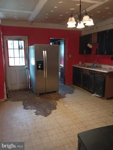 a view of a livingroom with furniture and chandelier