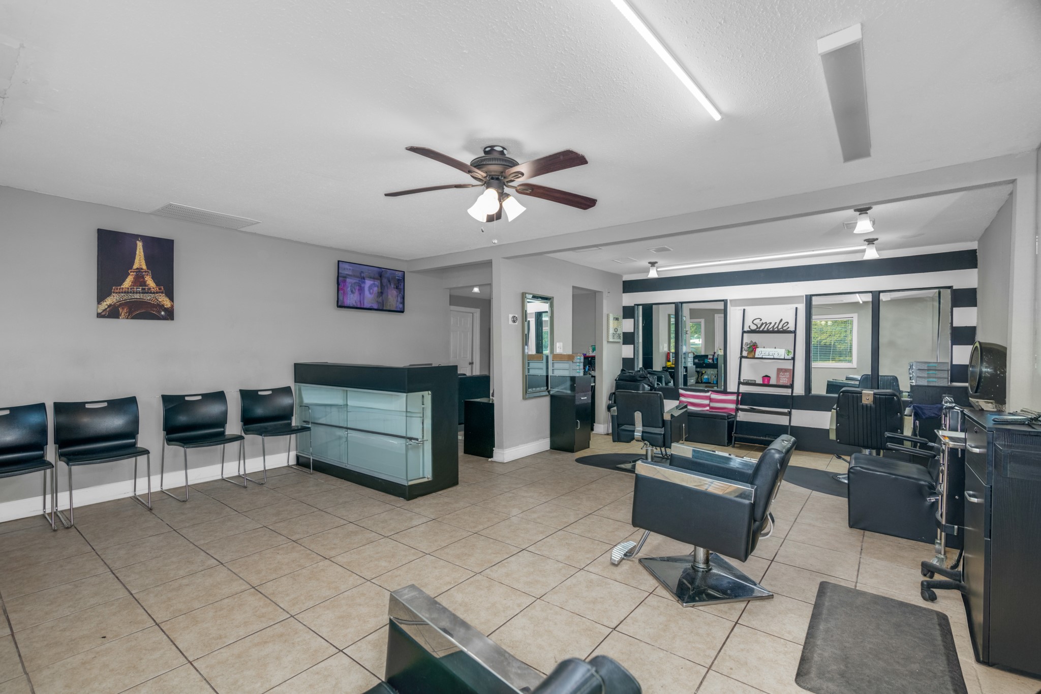 10041 Fulton Street Houston, TX 77076 - Photo 16 of 29 a living room with furniture and a ceiling fan