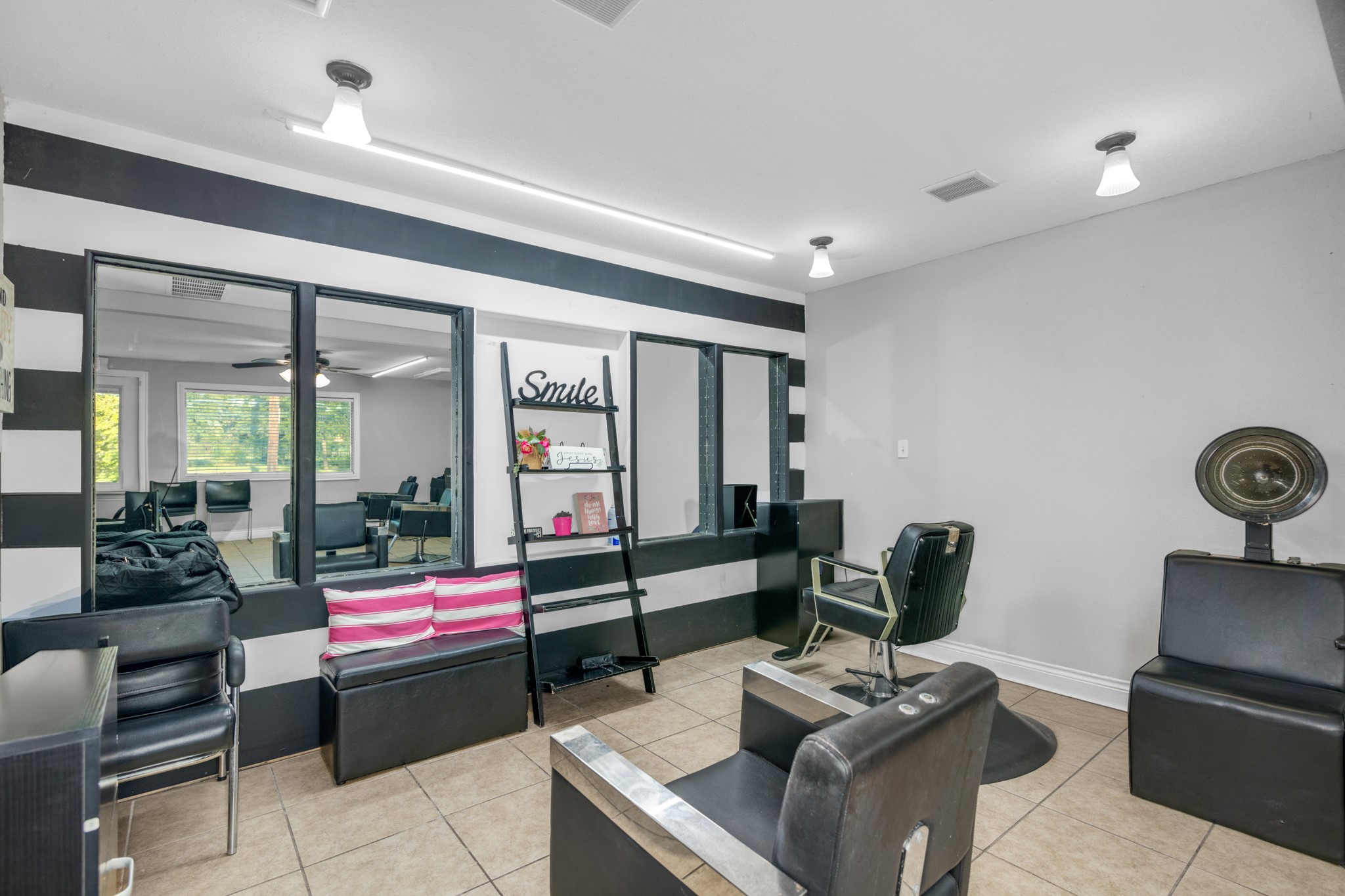 10041 Fulton Street Houston, TX 77076 - Photo 17 of 29 a living room with furniture and a floor to ceiling window