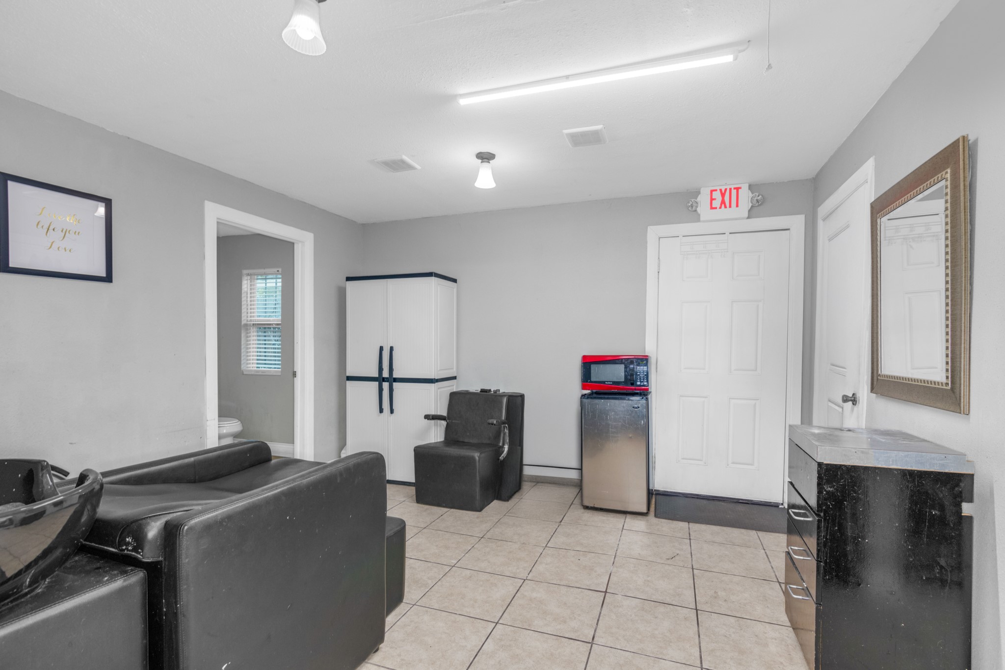 10041 Fulton Street Houston, TX 77076 - Photo 23 of 29 a living room with furniture and a window