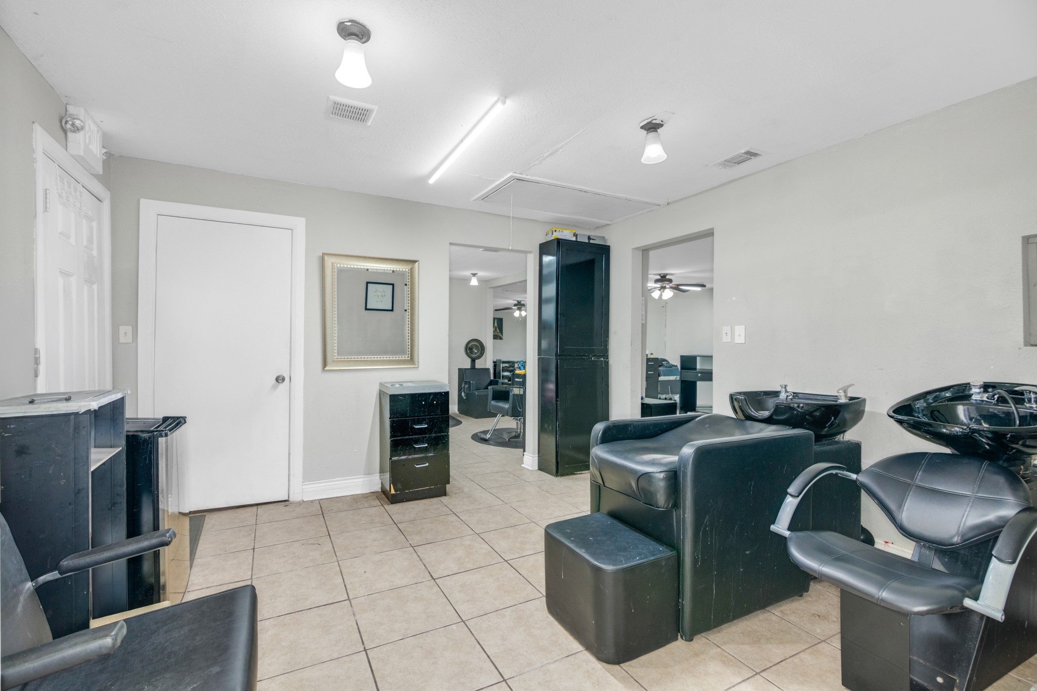 10041 Fulton Street Houston, TX 77076 - Photo 25 of 29 a living room with furniture and a flat screen tv