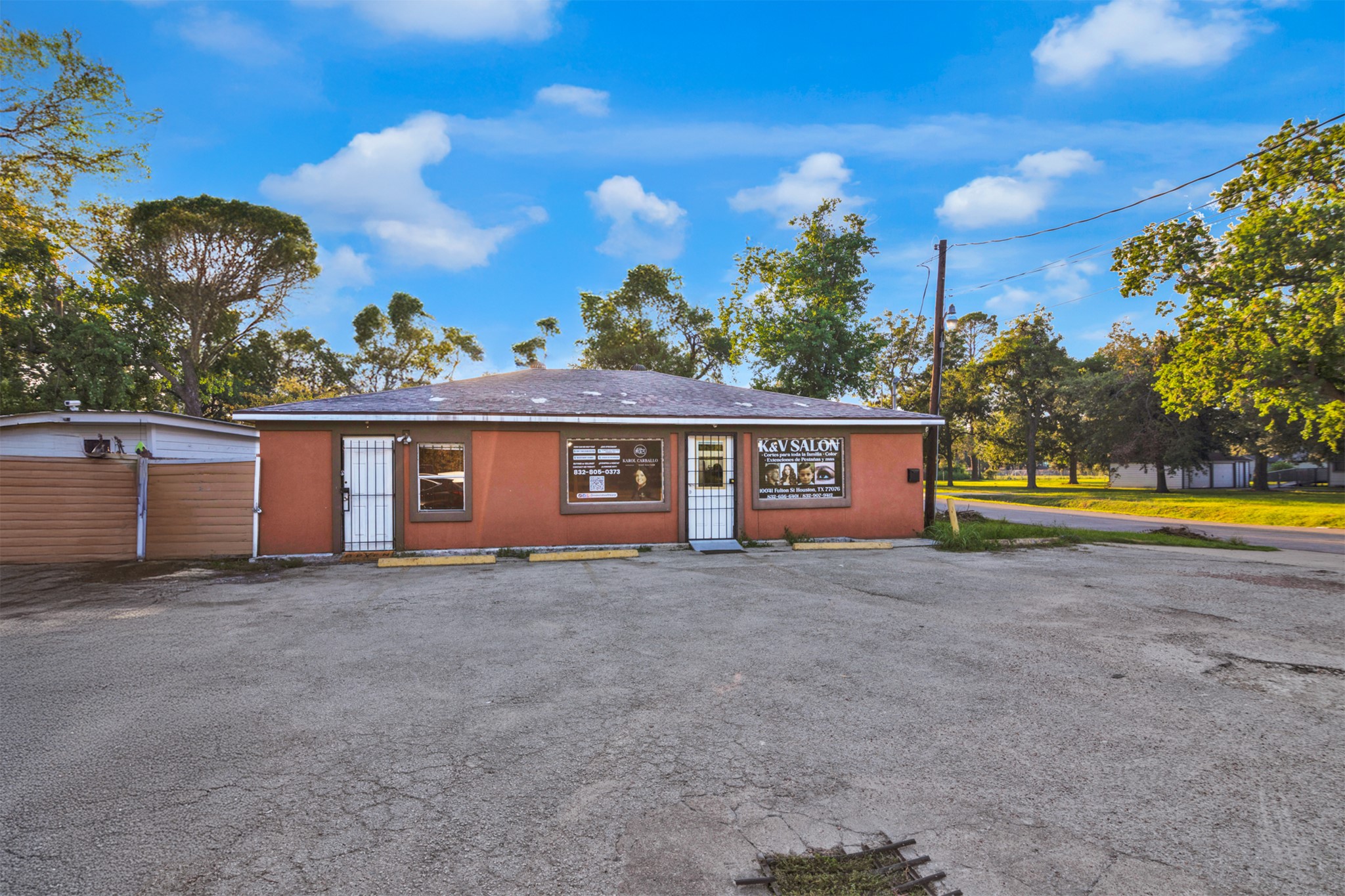 10041 Fulton Street Houston, TX 77076 - Photo 26 of 29 a view of a house with a yard and a large tree