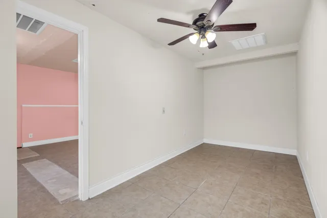 a bathroom with a sink toilet and a mirror