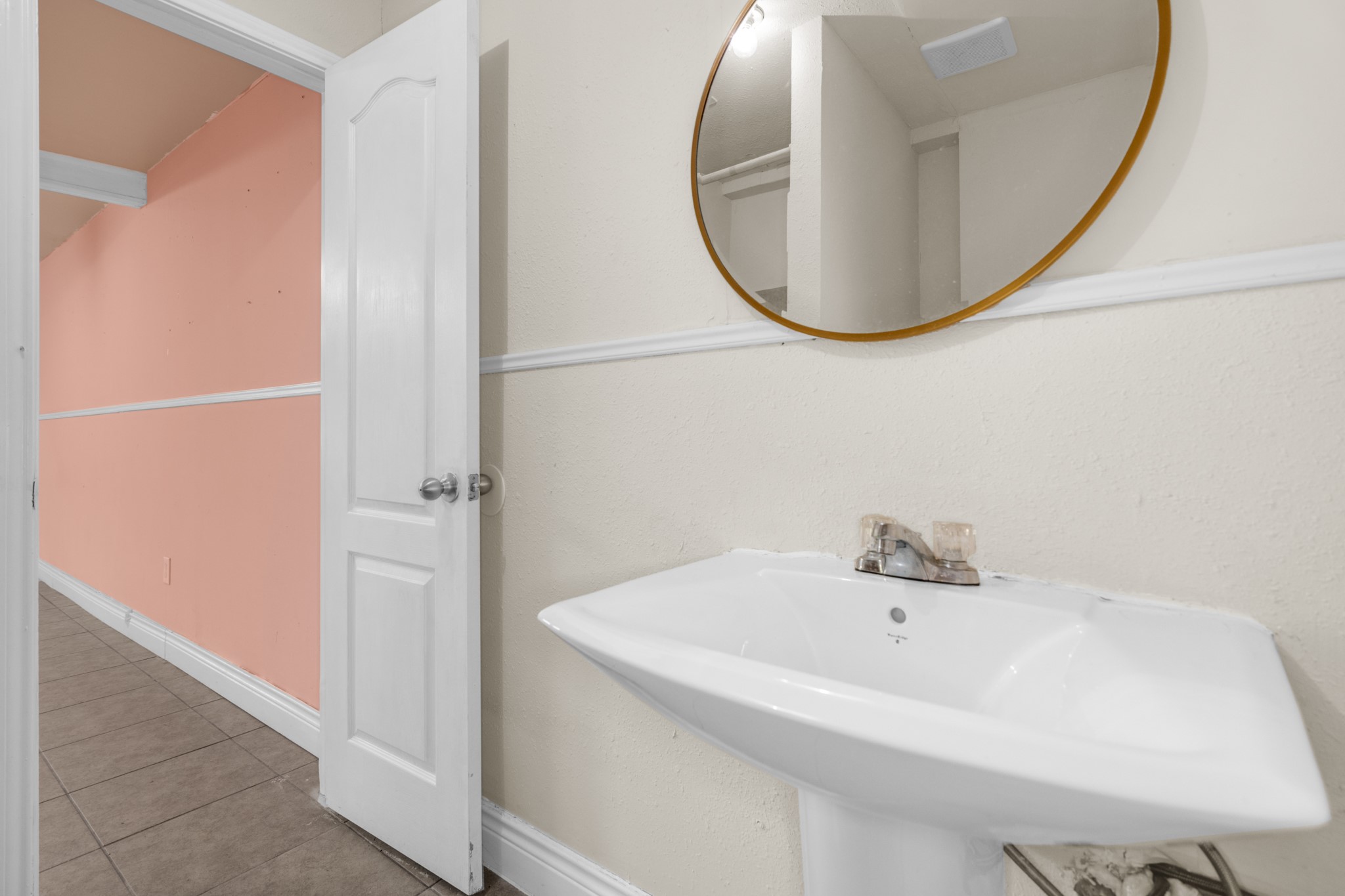 10041 Fulton Street Houston, TX 77076 - Photo 8 of 29 a bathroom with a sink and a mirror