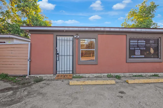 a living room with furniture and a ceiling fan