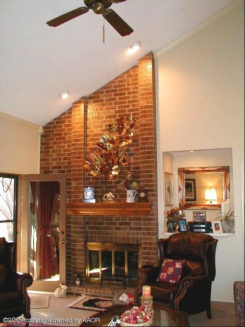 Den with Tall Ceiling and Fireplace
