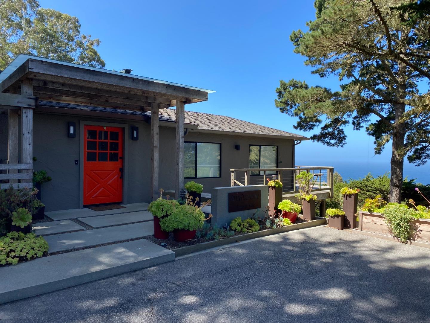 a front view of a house with yard