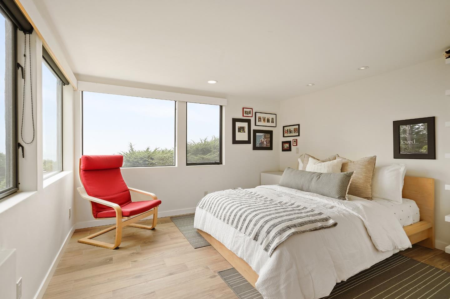 190 Upper Walden Road Carmel, CA 93923 - Photo 12 of 34 a bedroom with a bed chair and window