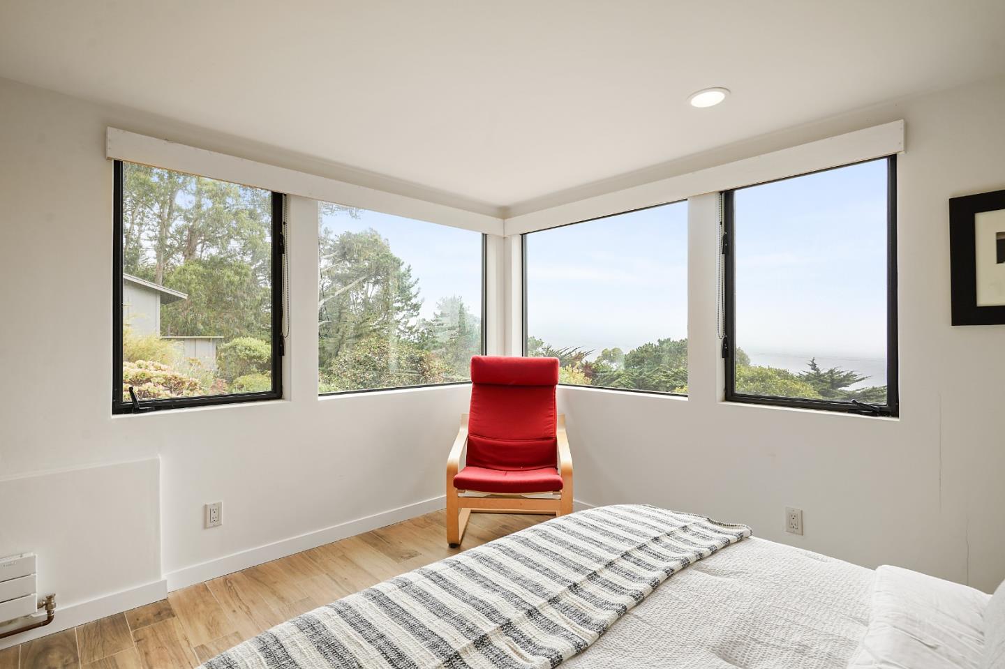 190 Upper Walden Road Carmel, CA 93923 - Photo 13 of 34 a bedroom with a bed and a window