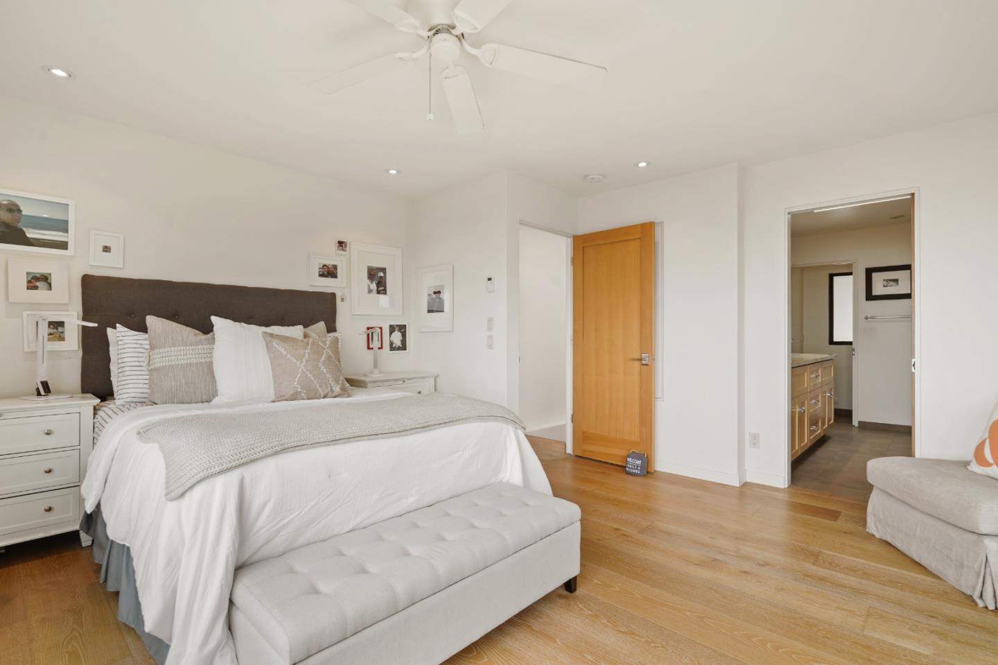 190 Upper Walden Road Carmel, CA 93923 - Photo 18 of 34 a spacious bedroom with a bed and a couch