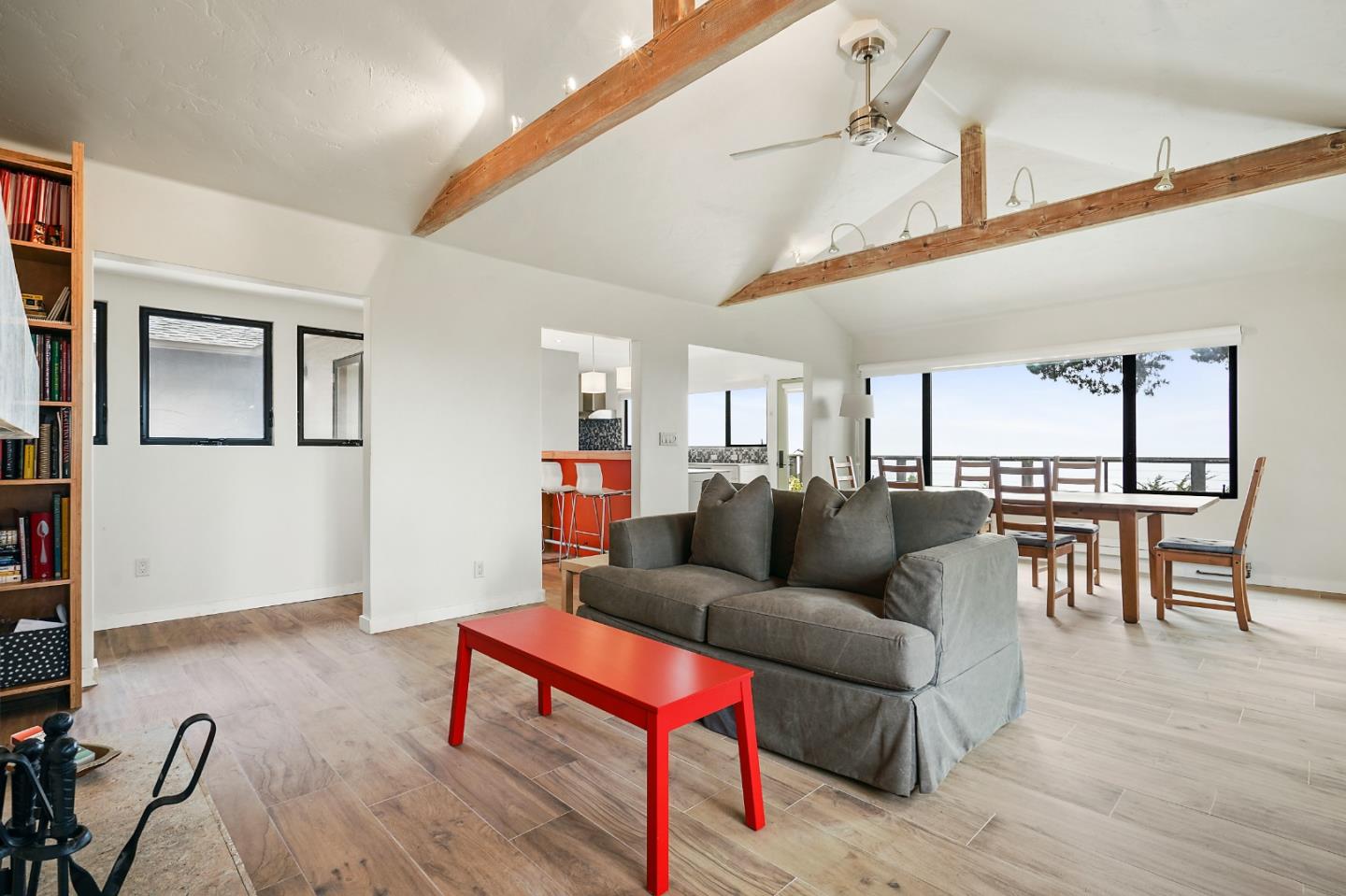 190 Upper Walden Road Carmel, CA 93923 - Photo 6 of 34 a living room with furniture kitchen view and a wooden floor