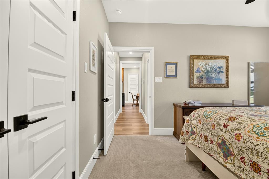 10828 Gregory Road Sanger, TX 76266 - Photo 27 of 37 Vaulted ceiling, neutral wall tones, white trim, paneled interior doors, and modern black hardware