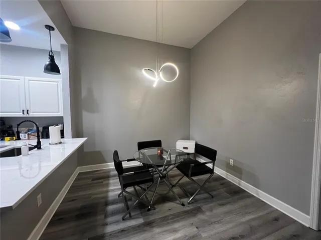 a view of a workspace with wooden floor