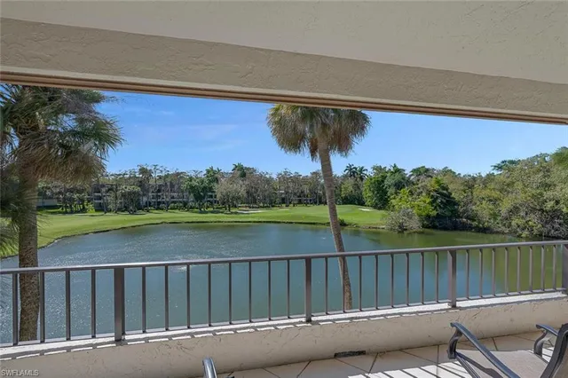 a view of a patio with a table & chairs