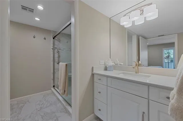 a bathroom with a double vanity sink and mirror