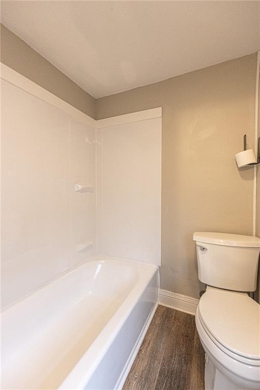 105 Washington Street Mount Pleasant, PA 15666 - Photo 22 of 29 a white toilet sitting next to a bath tub