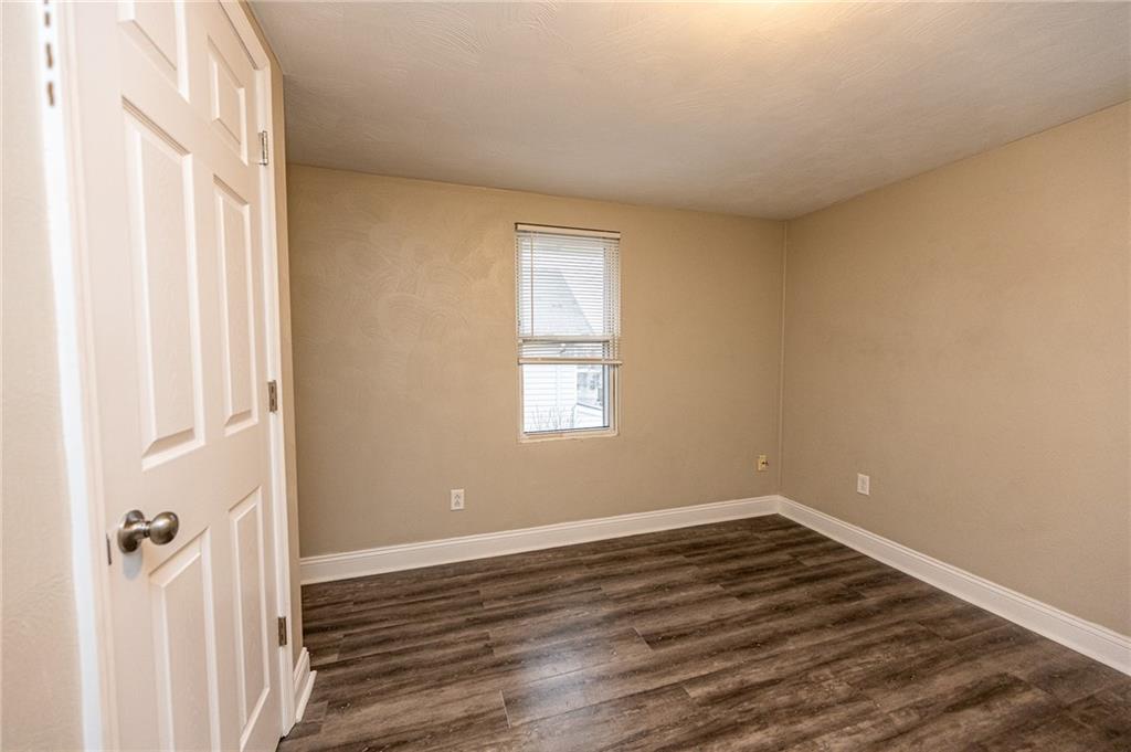 105 Washington Street Mount Pleasant, PA 15666 - Photo 23 of 29 a view of a room that has wooden floor and a window