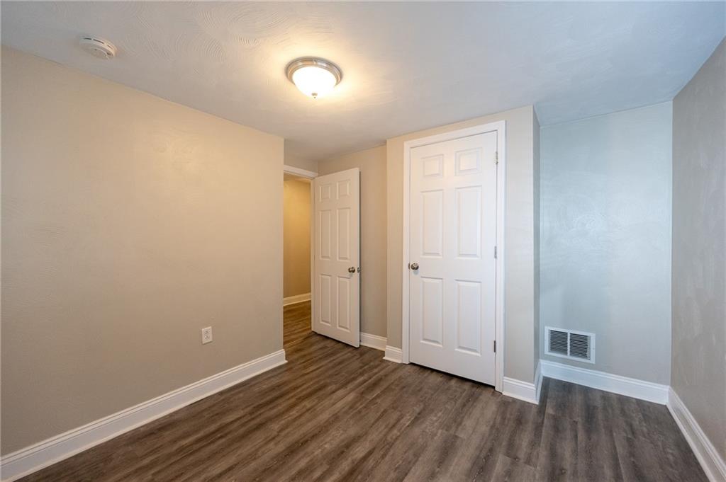105 Washington Street Mount Pleasant, PA 15666 - Photo 24 of 29 a view of a room with wooden floor