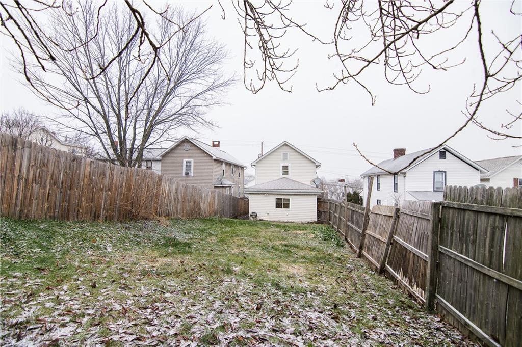 105 Washington Street Mount Pleasant, PA 15666 - Photo 28 of 29 a view of a house with wooden fence and a large tree