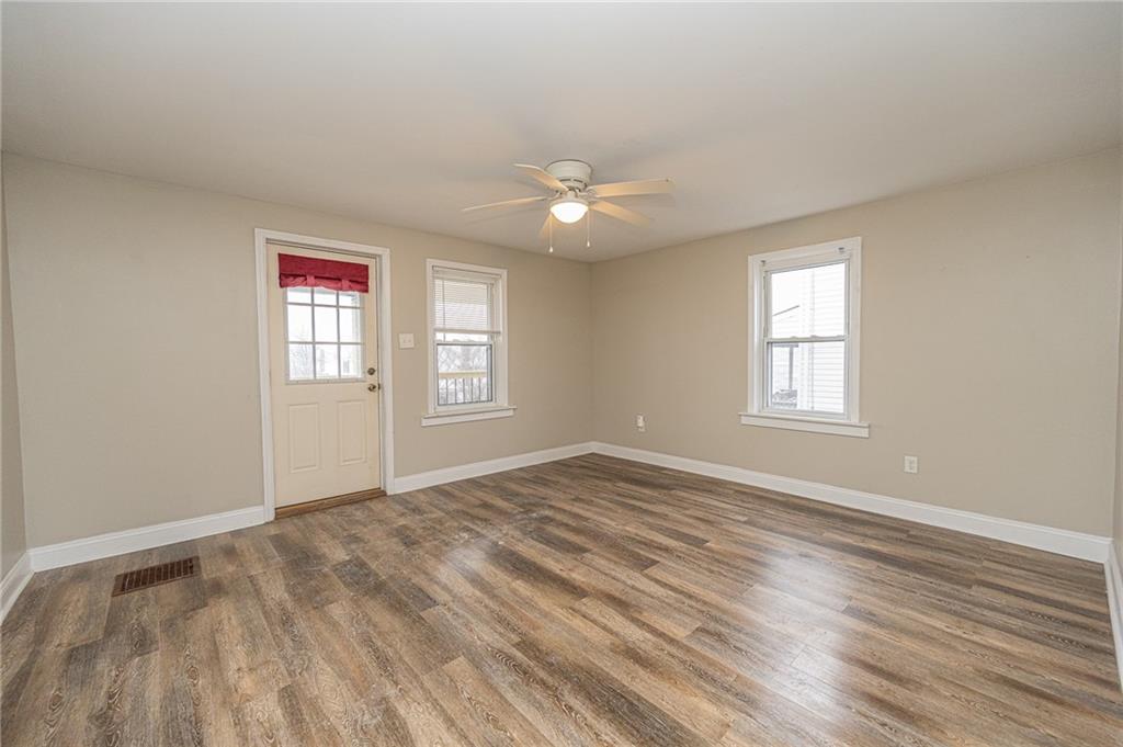 105 Washington Street Mount Pleasant, PA 15666 - Photo 10 of 29 a view of empty room with wooden floor and fan