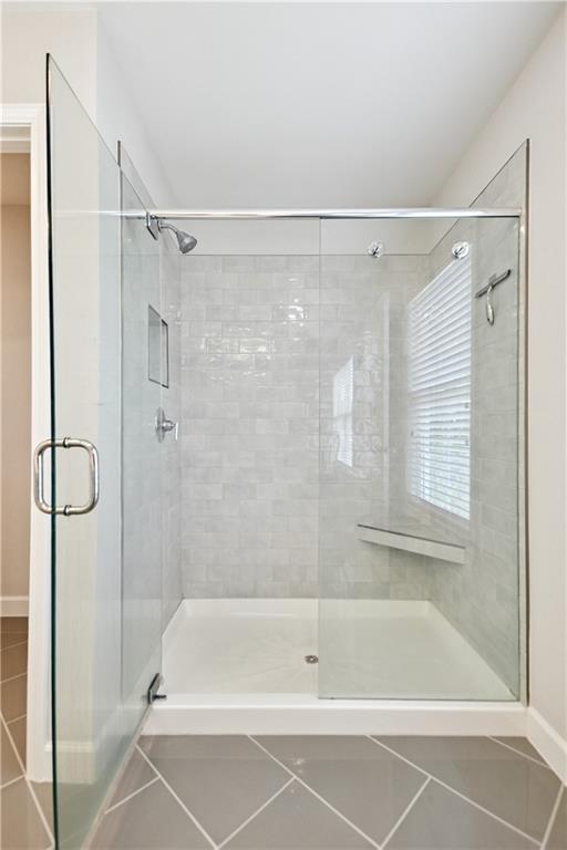 765 Trevett Way Marietta, GA 30066 - Photo 23 of 44 a bathroom with a shower and a bath tub