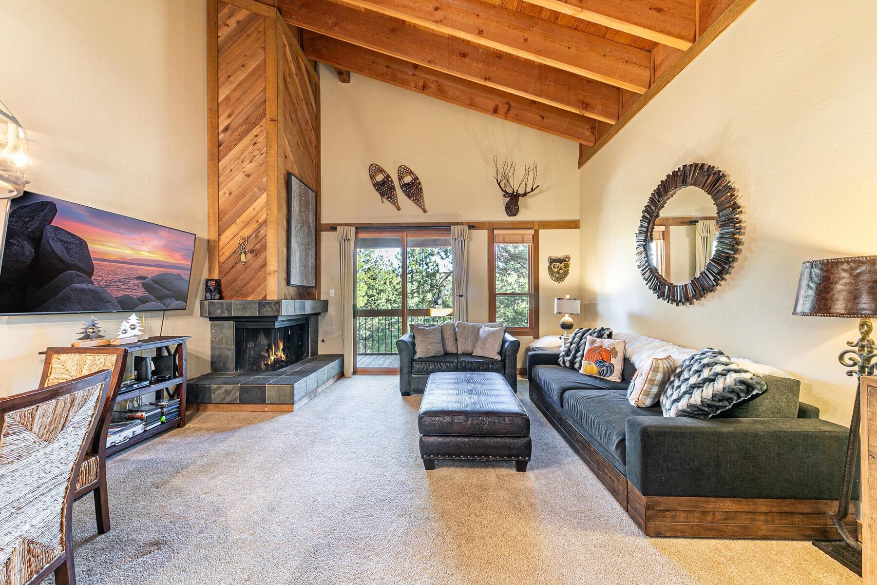 5105 Gold Bend Truckee, CA 96161 - Photo 6 of 27 a living room with furniture a fireplace and a table