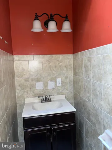 a bathroom with a shower and a sink
