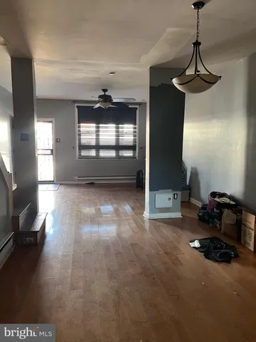 a room with gym equipment and windows