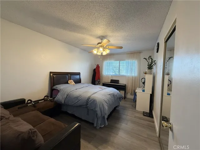 a bed room with a bed and a chandelier