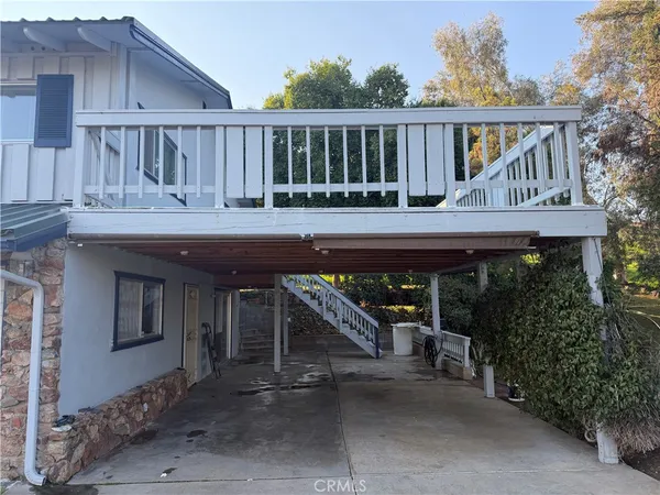 a view of house with a outdoor space and seating space