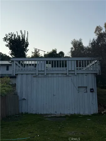 a view of a wooden fence and a big yard