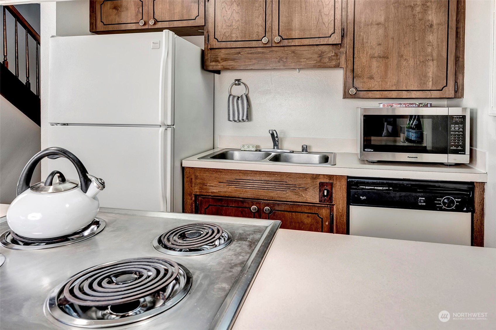 2912 Northeast 8th Street Renton, WA 98056 - Photo 8 of 22 a kitchen with granite countertop a stove and a sink