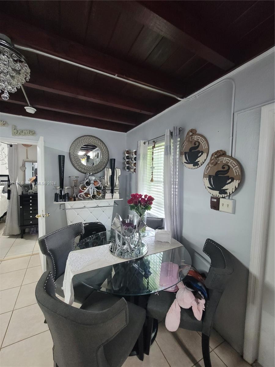 5719 Johnson Street, Unit 15 Hollywood, FL 33021 - Photo 20 of 29 a living room with furniture and a fireplace