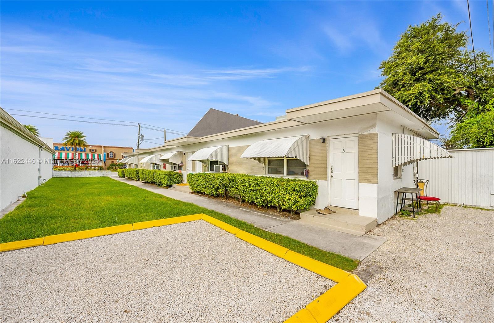 5719 Johnson Street, Unit 15 Hollywood, FL 33021 - Photo 3 of 29 a view of an house with swimming pool and porch