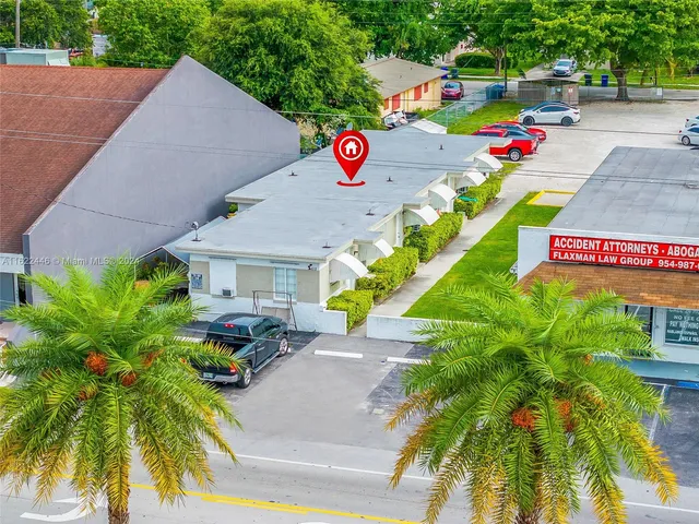 a sign that is sitting in front of flowers