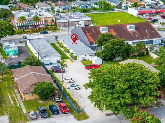 an aerial view of residential houses and outdoor space