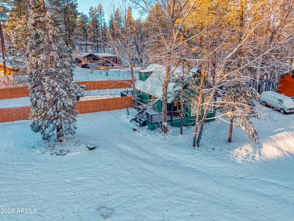 an aerial view of a house with outdoor space